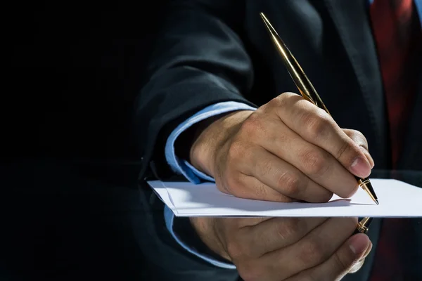 Businessman signing document