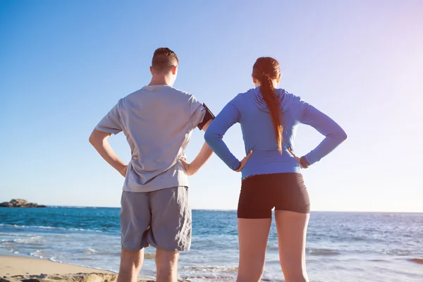 Couple of joggers on beach