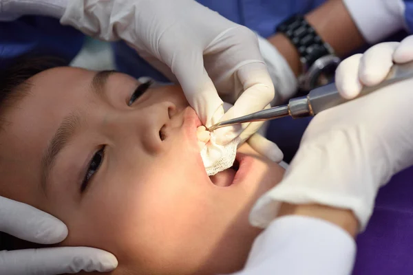 Boy on tooth extraction