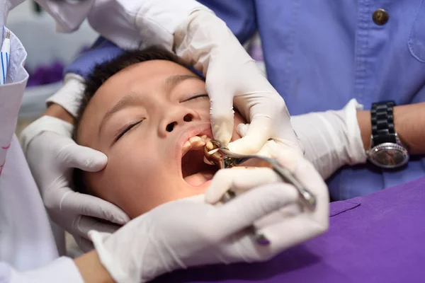 Boy on tooth extraction