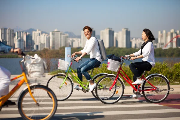 SEOUL, KOREA - APRIL 24, 2015: People cycling at a racreation pa