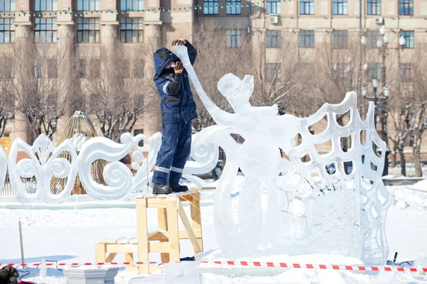 KHABAROVSK, RUSSIA - JANUARY 23,  2016: Sculptor working on ice