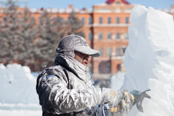 KHABAROVSK, RUSSIA - JANUARY 23,  2016: Sculptor working on ice