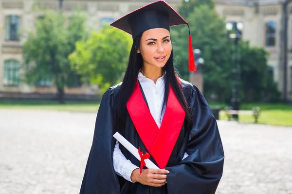 Happy woman portrait on her graduation day smiling