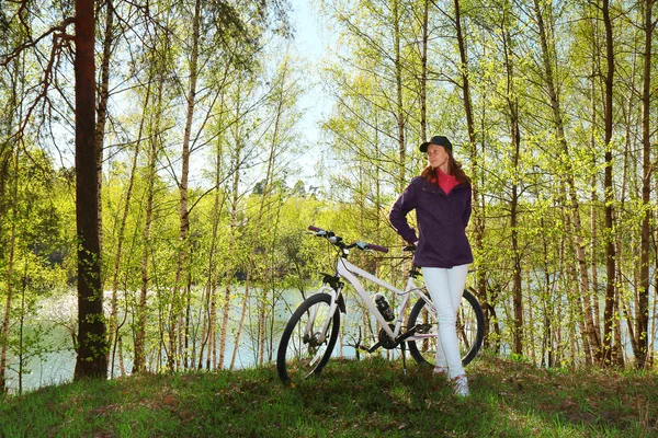 Bike riding - woman on bike in forest