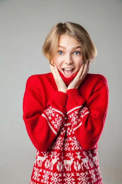 Girl wrapped in a warm knitted sweater.