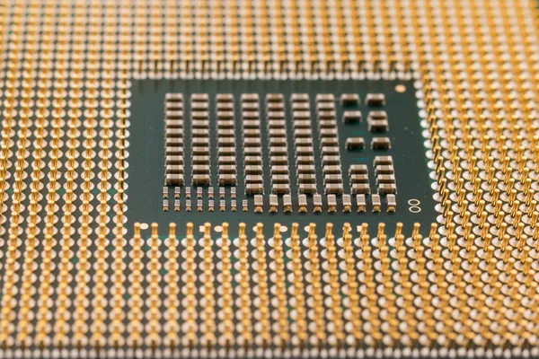 Geometry electronics, closeup of CPU Processor Chip, view from the bottom side, pin connectors