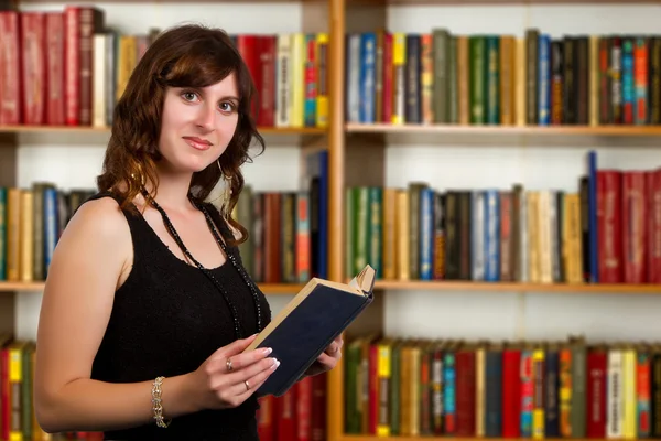 Portrait of clever student with open book