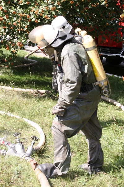 Firefighters in chemical protection suit