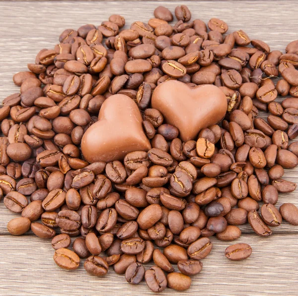 Heart candy on coffee beans