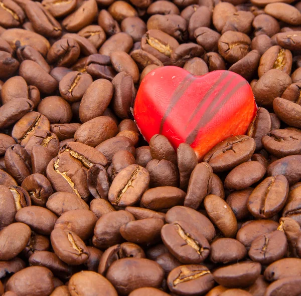 Heart candy on coffee beans