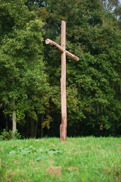 Wooden cross on a hill