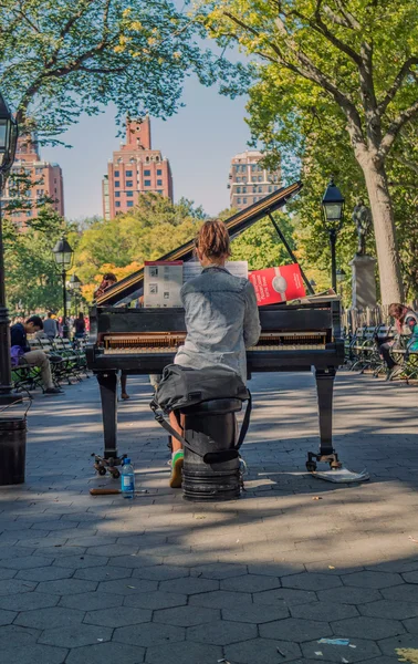 Playing piano at Washington Square Garden New York