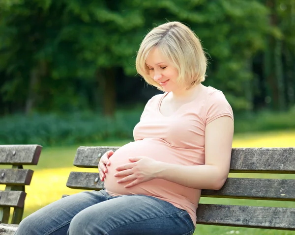 Pregnant woman in the park