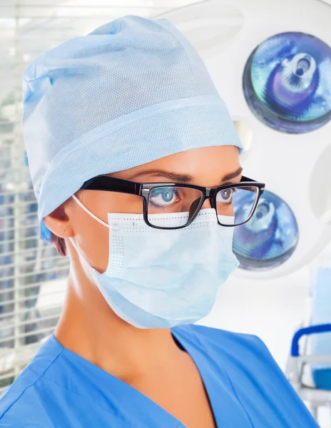 Female surgeon with medical devices