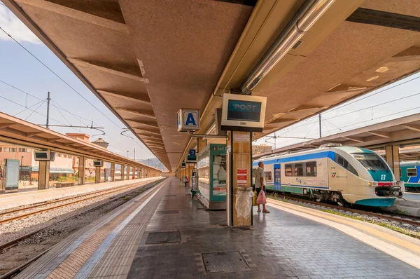 Platform and train at Palermo railway station, Italy