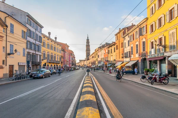 Main street with shops and people in Parma, Italy