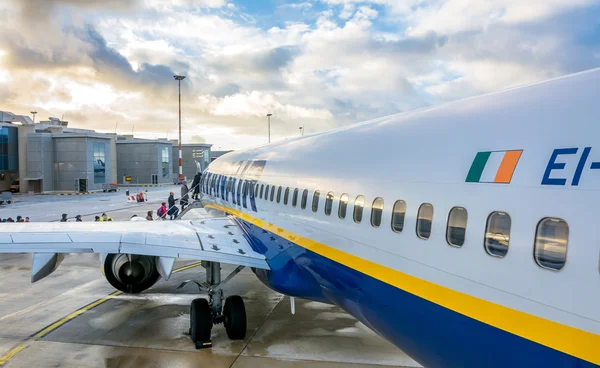 Passengers boarding Ryanair Jet airplane