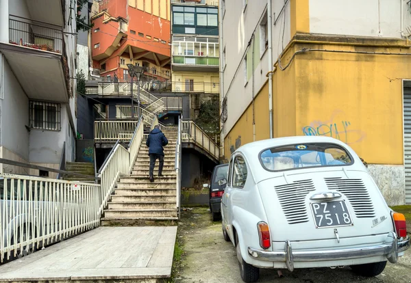 Downtown street view and old car in Potenza