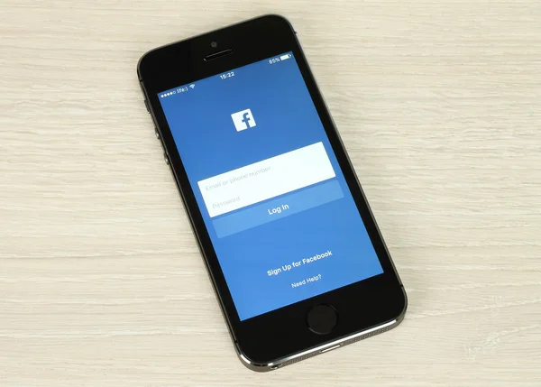 IPhone with Facebook login page on its screen