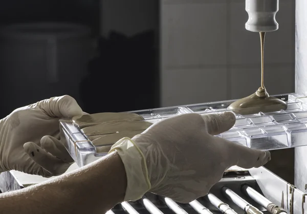 Woman making chocolate bar