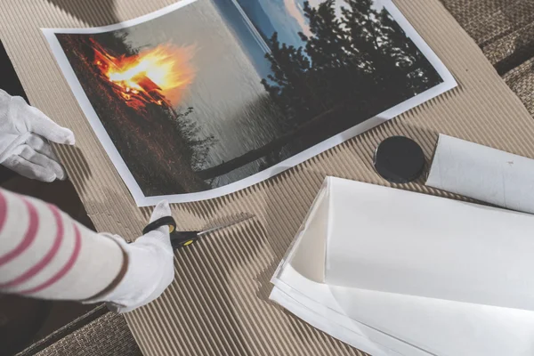 Woman packing of printed art picture