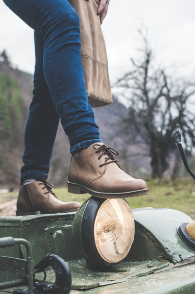 Woman legs with leather shoes