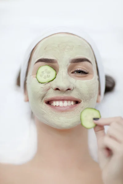 Woman with a face pack.