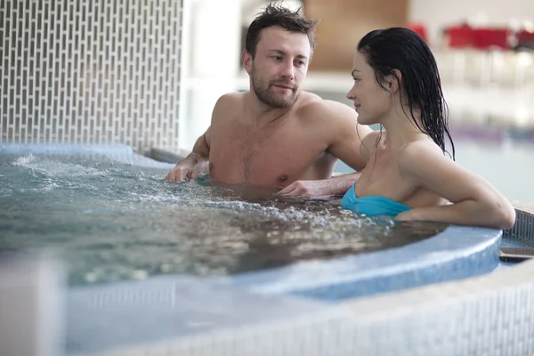 Couple relaxing in jacuzzi