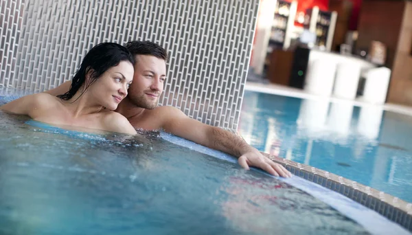 Couple relaxing in jacuzzi