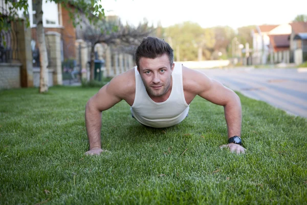 Fitness man doing push-ups