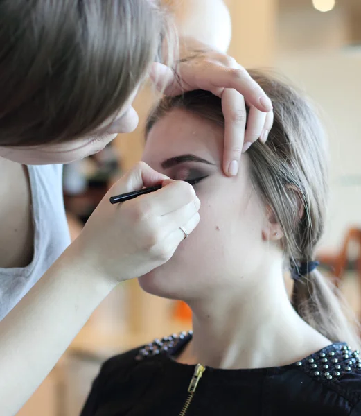 Makeup beautiful girl in beauty salon