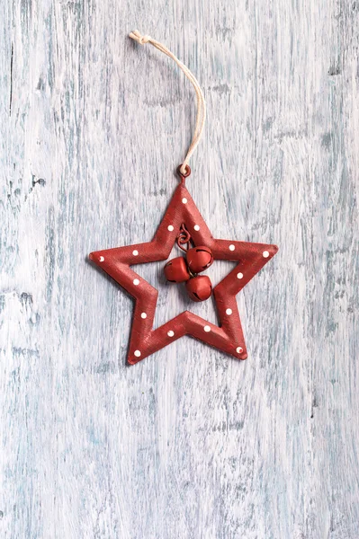 Vintage Christmas star decoration on  blue painted wood