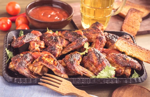 Grilled and spicy chicken wings