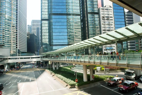 Modern architecture of glass and concrete in a huge city with cars of Hong Kong