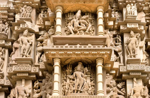 Sculptured surface of famous indian temple of Khajuraho with Hindu gods. UNESCO Heritage site
