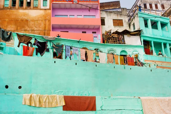 Colored walls of rustic Indian homes of poor people with balconies
