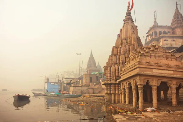 Early morning at Ganges river near the flooded ancient architecture Shiva temple