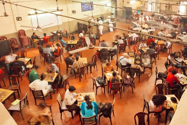 People having breakfast inside traditional Indian Coffee House