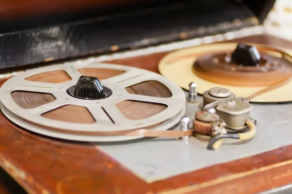 Magnetic tape with the music playing on the vintage reel tape recorder