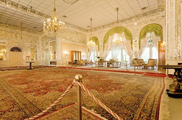 Colorful interior of the Qajar royal dinasty Golestan Palace with persian carpets around