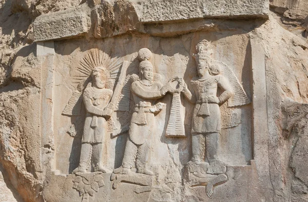 Persian kings on stone relief of the monument Taq-e Bostan in Iran. Taq-e Bostan is rock relief from 4 century