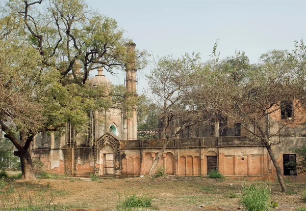 Park with structures of Lucknow Residency built in mughal style in India. Residency took place between 1780 to 1800.