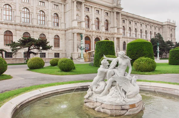 Famous Museum of Natural History in Vienna and green park with historical fountains, Austria