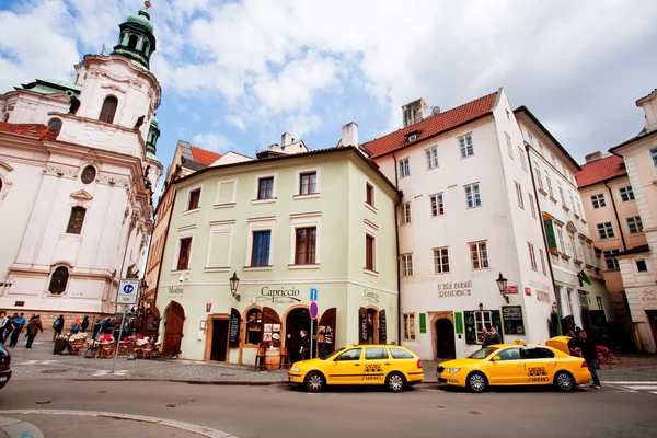 Old city with historical buildings and taxi cars