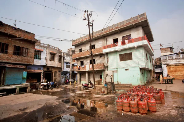 Gas cylinders put on a dirty street of India
