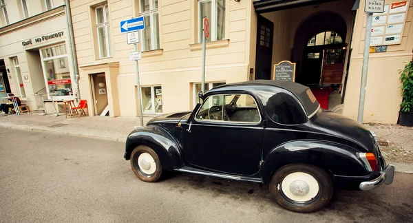 Retro auto made by Fiat company stoped on the empty street