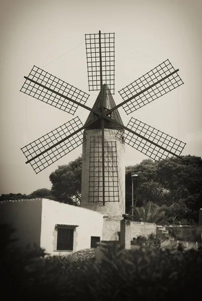 Portrait of classic old tower windmill. Old photo effect.