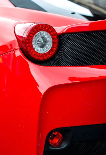 Close-up view of red sports car rear light.
