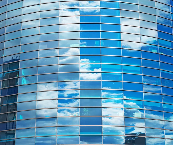 Modern round glass building in the city.